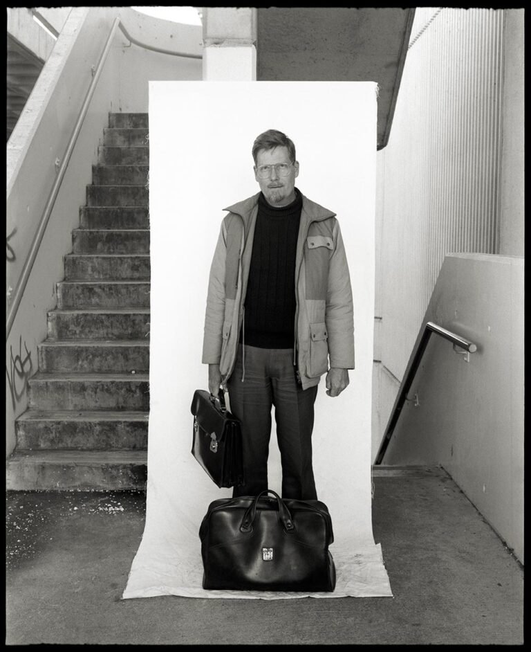 Belconnen Mall parking area stairwell 1990: Man with two bags