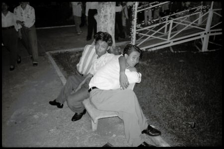 Documentary photographic portrait by Spiros Coutroubas, Vietnam, 1996 Vietnam 1996: portrait of young men relaxing on new year's eve in Saigon, by Spiros Coutroubas, part of a series of documentary photographs of people and places in Vietnam in the 1990s