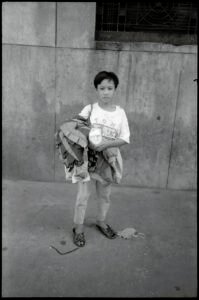 Documentary photographic portrait by Spiros Coutroubas, Vietnam, 1996 Vietnam 1996: portrait of a boy working in the clothing industry, by Spiros Coutroubas, part of a series of documentary photographs of people and places in Vietnam in the 1990s