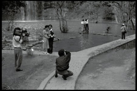 Documentary photographic portrait by Spiros Coutroubas, Prinn Falls, Vietnam, 1996 Vietnam 1996: photographs of photgraphers at work, at Prinn Falls, near Dalat, by Spiros Coutroubas - part of a series of documentary photographs of people and places in Vietnam in the 1990s