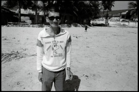 Photographic portrait of a man on the beach by Spiros Coutroubas, Nha Trang, Vietnam, 1996 Vietnam 1996: portrait of a man on the beach in Nha Trang, by Spiros Coutroubas, part of a series of documentary photographs of people and places in Vietnam in the 1990s