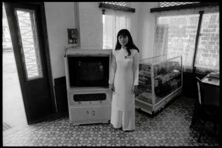 Photographic portrait of a receptionist by Spiros Coutroubas, Hue, Vietnam, 1996 Vietnam 1996: portrait of a receptionist in Hue, by Spiros Coutroubas - part of a series of documentary photographs of people and places in Vietnam in the 1990s
