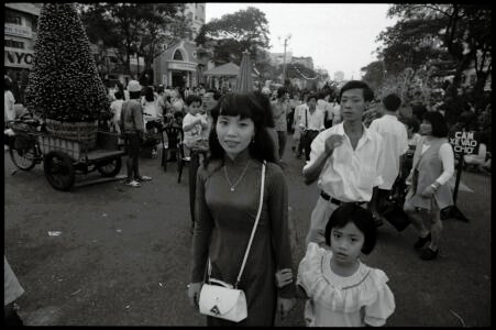 Photographic portrait by Spiros Coutroubas, Vietnam, 1996 Vietnam 1996: portrait of a mother and daughter at Tet in Saigon, by Spiros Coutroubas - part of a series of documentary photographs of people and places in Vietnam in the 1990s