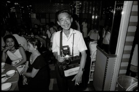 Photographic portrait by Spiros Coutroubas, Ho Chi Minh City, Vietnam, 1996 Vietnam 1996: portrait of a photgrapher in Saigon, by Spiros Coutroubas - part of a series of documentary photographs of people and places in Vietnam in the 1990s