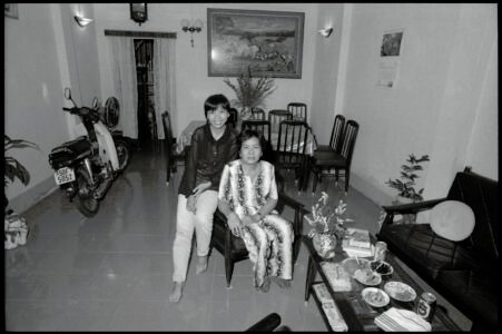 Photographic portrait of Ms Loan and her mother at home by Spiros Coutroubas, Ho Chi Minh City, Vietnam, 1997 Vietnam 1997: portrait of Ms Loan and her mother at home in Saigon, by Spiros Coutroubas - part of a series of documentary photographs of people and places in Vietnam in the 1990s